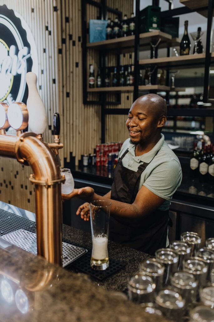 strikers-lounge-staff-member-working-behind-bar