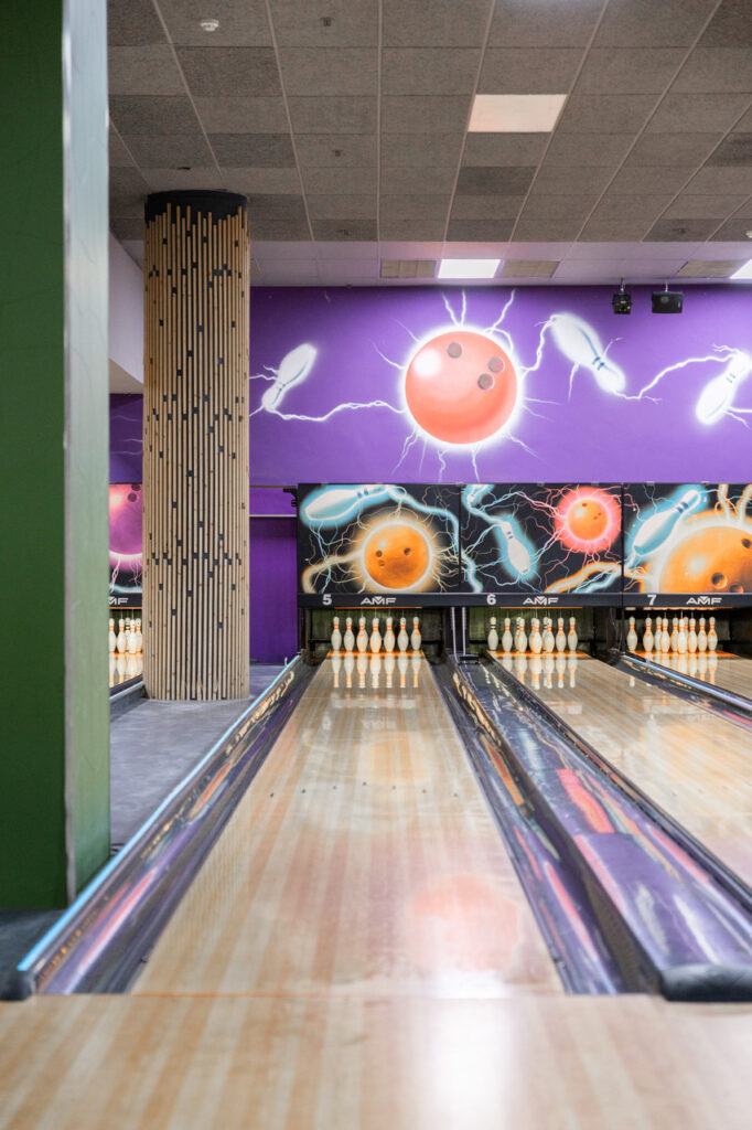 bowling-alley-lanes-with-lightning-themed-wall-art